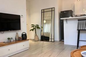 TV a/nebo společenská místnost v ubytování Cosy F11 + 8 fotografií
