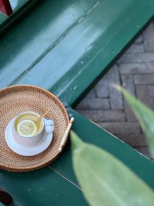 a cup of coffee sitting on a table at 北京悦明元星空白塔景观四合院民宿 in Beijing