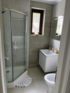 Koupelna v ubytování Tonka Apartment + 9 fotografií