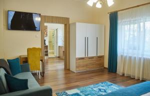 a living room with a couch and a cabinet at CONFORT HOUSE PLUS in Alba Iulia
