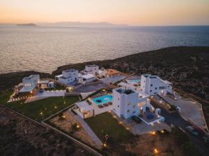 an aerial view of a villa with the ocean in the background at Tholaria Villa in Chania Town