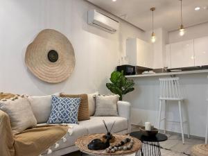 a living room with a couch and a table at Le Bohémien in La Marsa