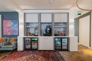 a living room with a large white refrigerator at Hotel JL No76 in Amsterdam