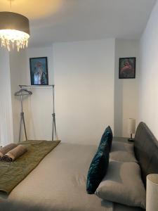 a living room with a couch and a bed at lovely place near to beach in Brighton & Hove