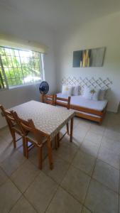 a living room with a couch and a table at Cozy Apartment in La Romana