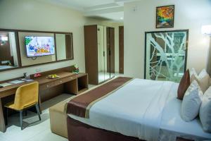 Voodi või voodid majutusasutuse Carlton Swiss Grand Hotel toas