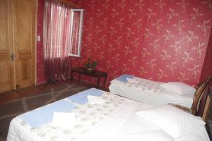Postel nebo postele na pokoji v ubytování Guest House Nona
