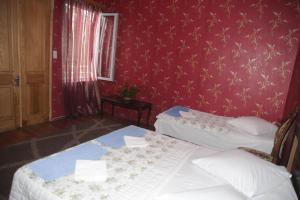 Postel nebo postele na pokoji v ubytování Guest House Nona