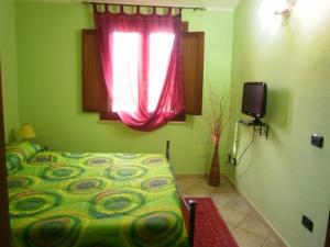 A bed or beds in a room at Agriturismo S´Aranada