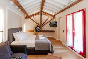 Postel nebo postele na pokoji v ubytování Danae Hotel