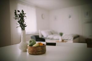a bowl of fruit on a table in a living room at Studio Apartment E&D, free private parking, loggia in Zagreb
