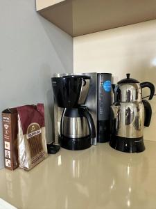 a coffee maker and a coffee pot on a counter at BUREAU RESİDENCE STÜDYO DAİRE in Kartepe