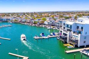 an aerial view of a marina with boats in the water at Marina Magic Getaways - Your Waterfront Retreat in Patterson Lakes