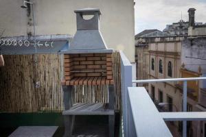 a bird house sitting on top of a balcony at Casa con piscina junto catedral de sevilla in Seville