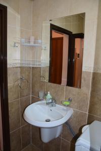 a bathroom with a white sink and a mirror at Studio Sveti Vlas "SEA BREEZE" in Sveti Vlas