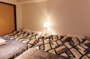 En eller flere senge i et værelse på 四谷松本館ビル