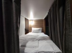 Postel nebo postele na pokoji v ubytování N5 Ratchawong Hostel
