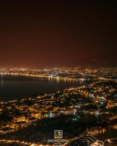 a view of a city at night at Belvedere Hotel in Kalamata