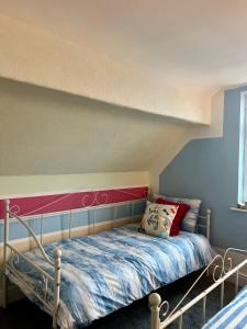 a bed in a room with at Quirky Attic Blackpool in Blackpool