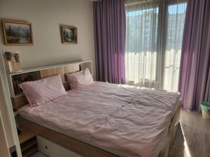 Postel nebo postele na pokoji v ubytování Harmony apartment