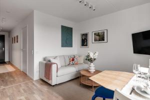 Khu vực ghế ngồi tại Cosy Urban Home in Stockholm