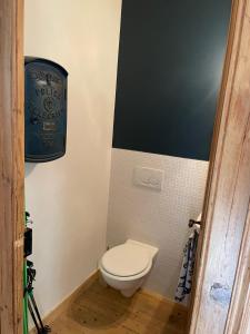 a small bathroom with a toilet in a room at A Room in Grands Charmoz in Chamonix-Mont-Blanc