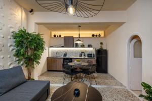 a living room with a couch and a table at Townhall Apartment in Symi