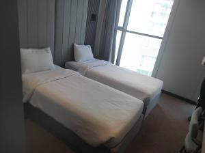 Postel nebo postele na pokoji v ubytování SHERLOCK HOMES HOTELS