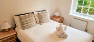 Cama ou camas em um quarto em Tregenna Castle Resort