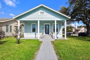 a blue house with a pathway in front of it at Luxury Designer Villa by the Beach Bright Beautiful Brand New in Galveston