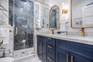 a bathroom with a blue sink and a shower at Luxury Designer Villa by the Beach Bright Beautiful Brand New in Galveston
