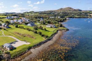 an aerial view of a town next to a body of water at Rosapenna Golf Cottage, Donegal, Ireland in Downings