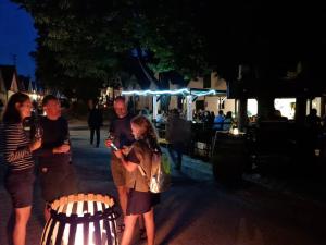 a group of people standing on a street at night at Refugium Ottenthal in Ottenthal