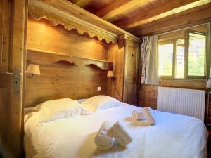 Ein Bett oder Betten in einem Zimmer der Unterkunft Appartement Méribel, 5 pièces, 10 personnes - FR-1-688-56