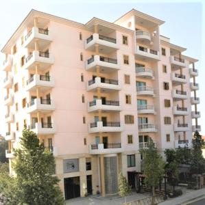 an apartment building with balconies on a street at Klimentos Flat 59 in Nicosia