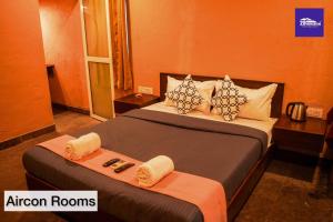 a hotel room with two beds in a room at Boutique Room At Bora Bora in Vaishet