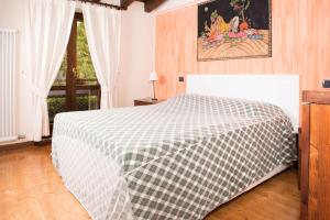 En eller flere senger på et rom på Villa Costabella
