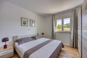 Ένα ή περισσότερα κρεβάτια σε δωμάτιο στο Villa Brijona +25 φωτογραφίες