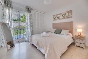Un ou plusieurs lits dans un hébergement de l'établissement Marbella Paradise