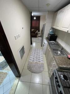 a small kitchen with a sink and a stove at شقق فندقيه in Dubai