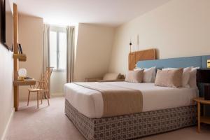 Postel nebo postele na pokoji v ubytování Le Plessis Grand Hotel