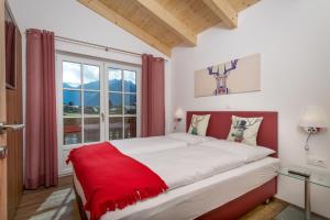 Katil atau katil-katil dalam bilik di Hochalmbahnen Chalets Rauris 1-03 Maislaufeldweg 1c