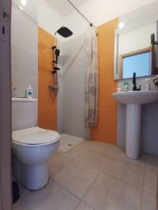 a bathroom with a toilet and a sink at Nadushka Voyage appartement in Agadir in Agadir