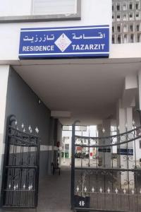 a entrance to a building with a sign on it at Nadushka Voyage appartement in Agadir in Agadir