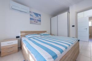 En eller flere senge i et værelse på Holiday house Gracijela