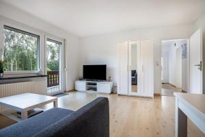 a living room with a couch and a table at Ferienwohnung Große in Osterode