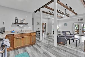 a kitchen and living room with a couch and a table at Bulverde Cottage at Moonlight Getaway in Bulverde