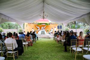 a group of people sitting in chairs under a tent at Hotel Quinta los Duraznos in Villa Doctor Mora +38 photos