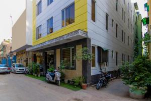 a motorcycle parked in front of a building at Baba Residency - 5 Minutes from railway station in New Delhi