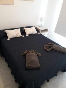Ein Bett oder Betten in einem Zimmer der Unterkunft El espacio de Caro